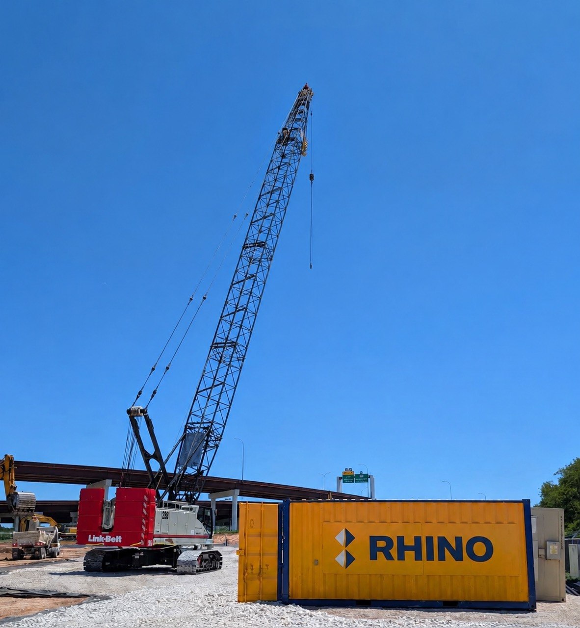 Rhino Link-Belt lattice-boom crawler crane on bridge construction jobsite