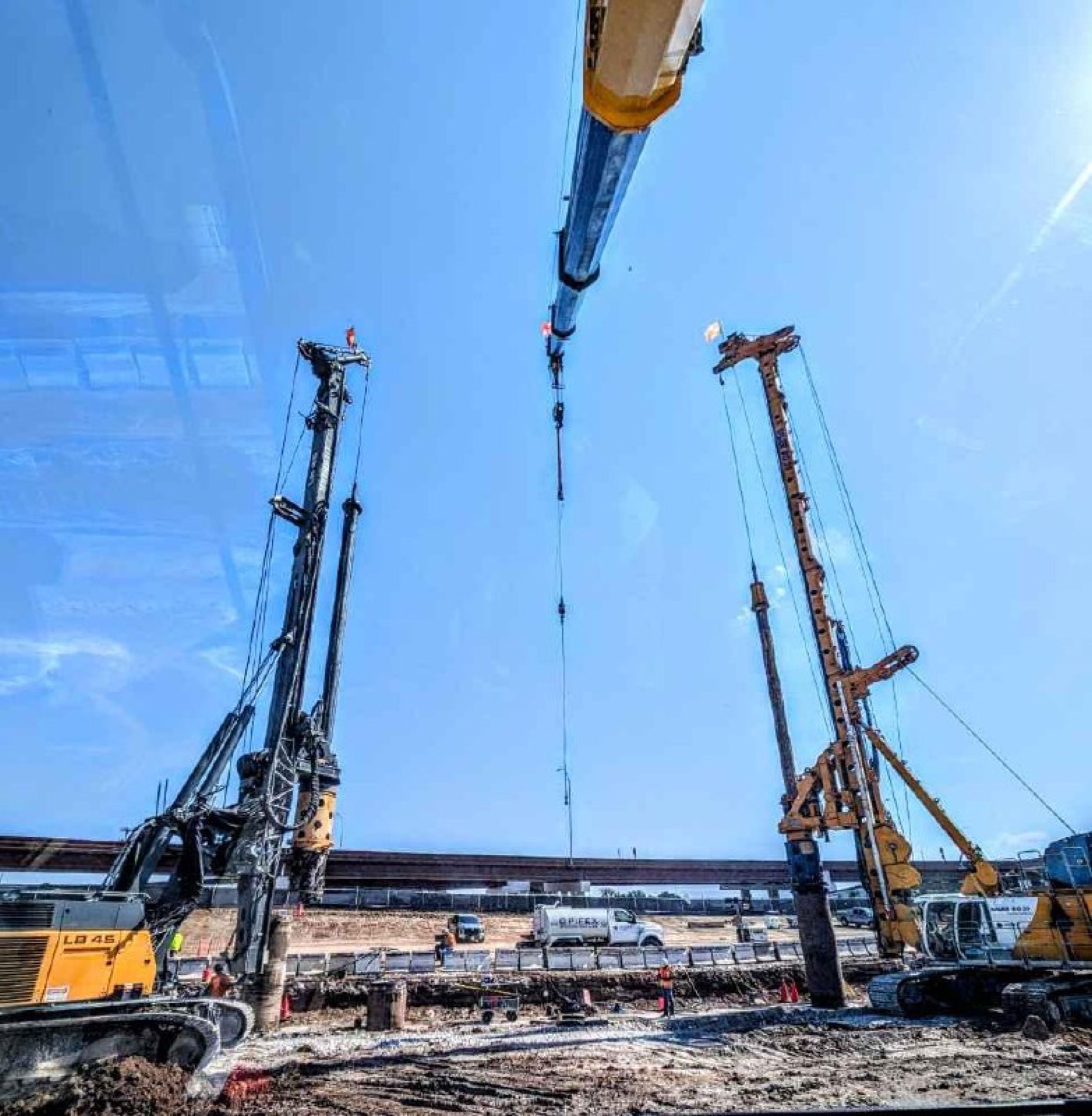 Rhino hydraulic crane supporting Bauer pier drillers on Austin water infrastructure project