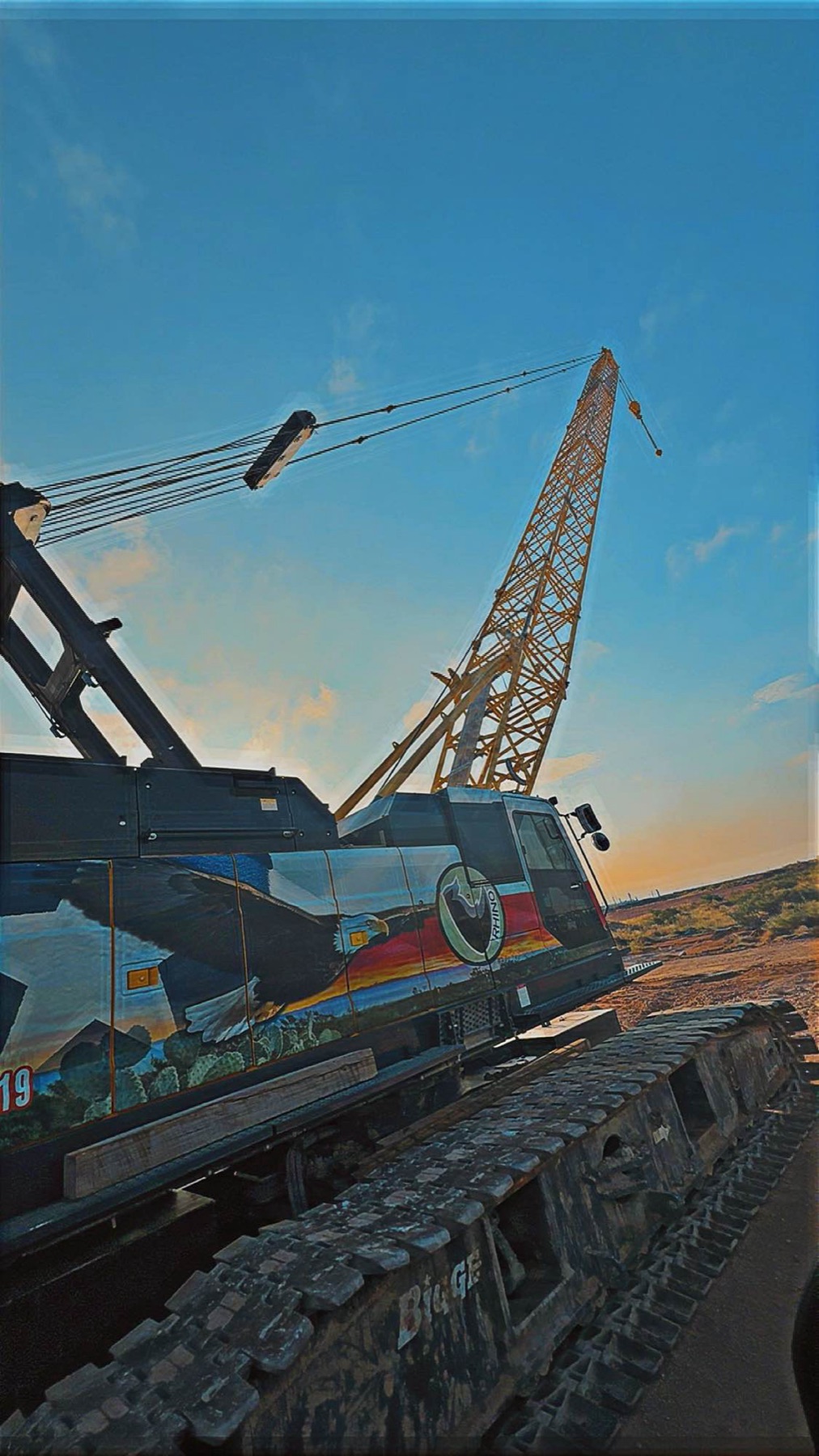 Bigge crawler at sunset with Texas mural