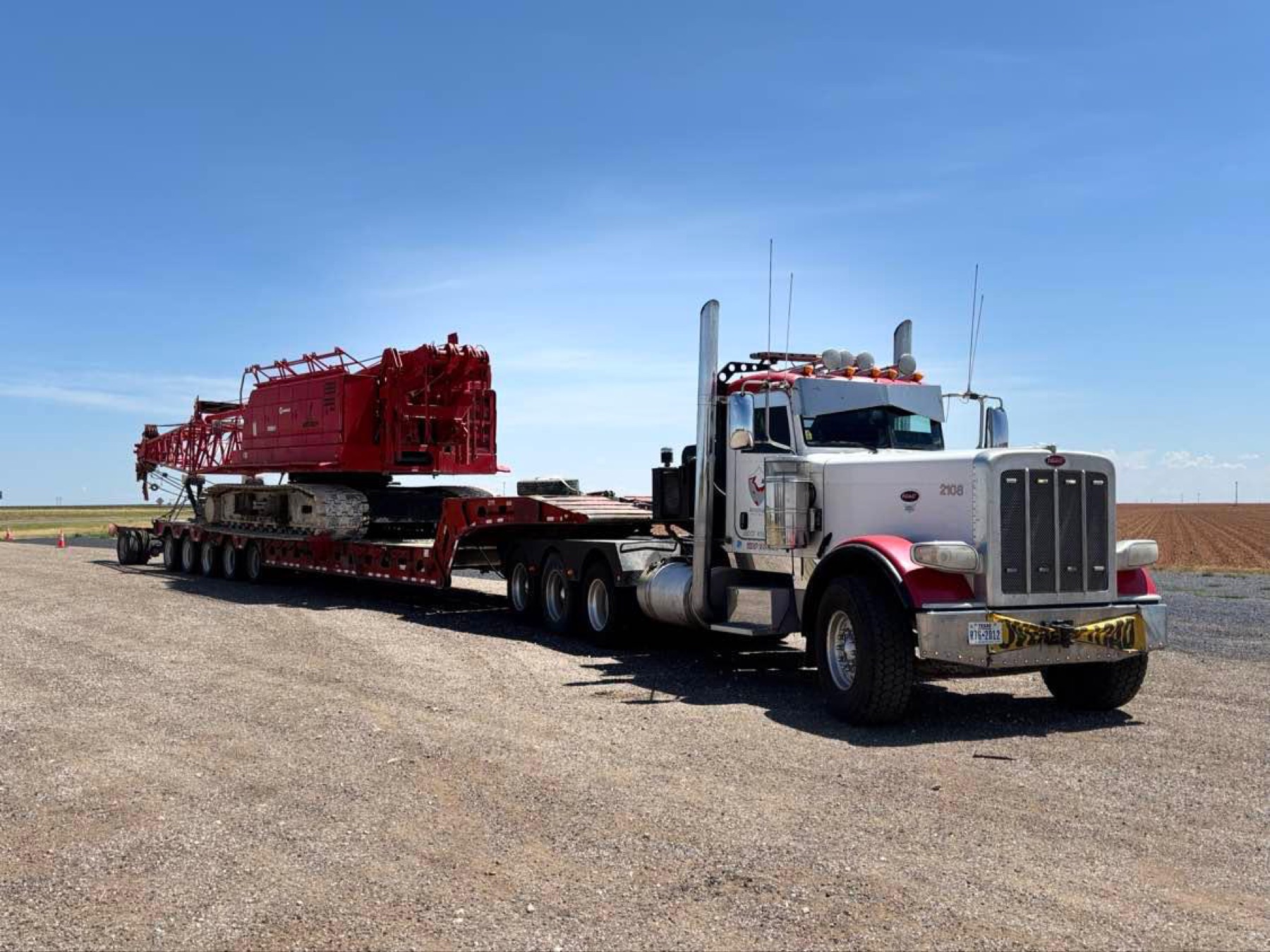 Rhino Peterbilt winch truck hauling crawler crane