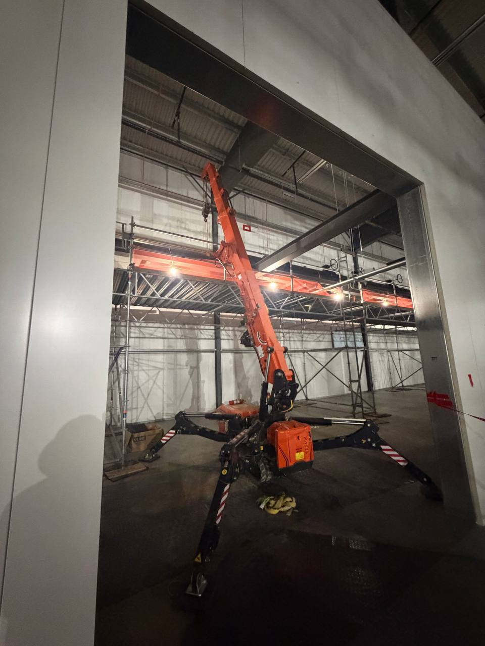 Jekko spider crane through industrial doorway
