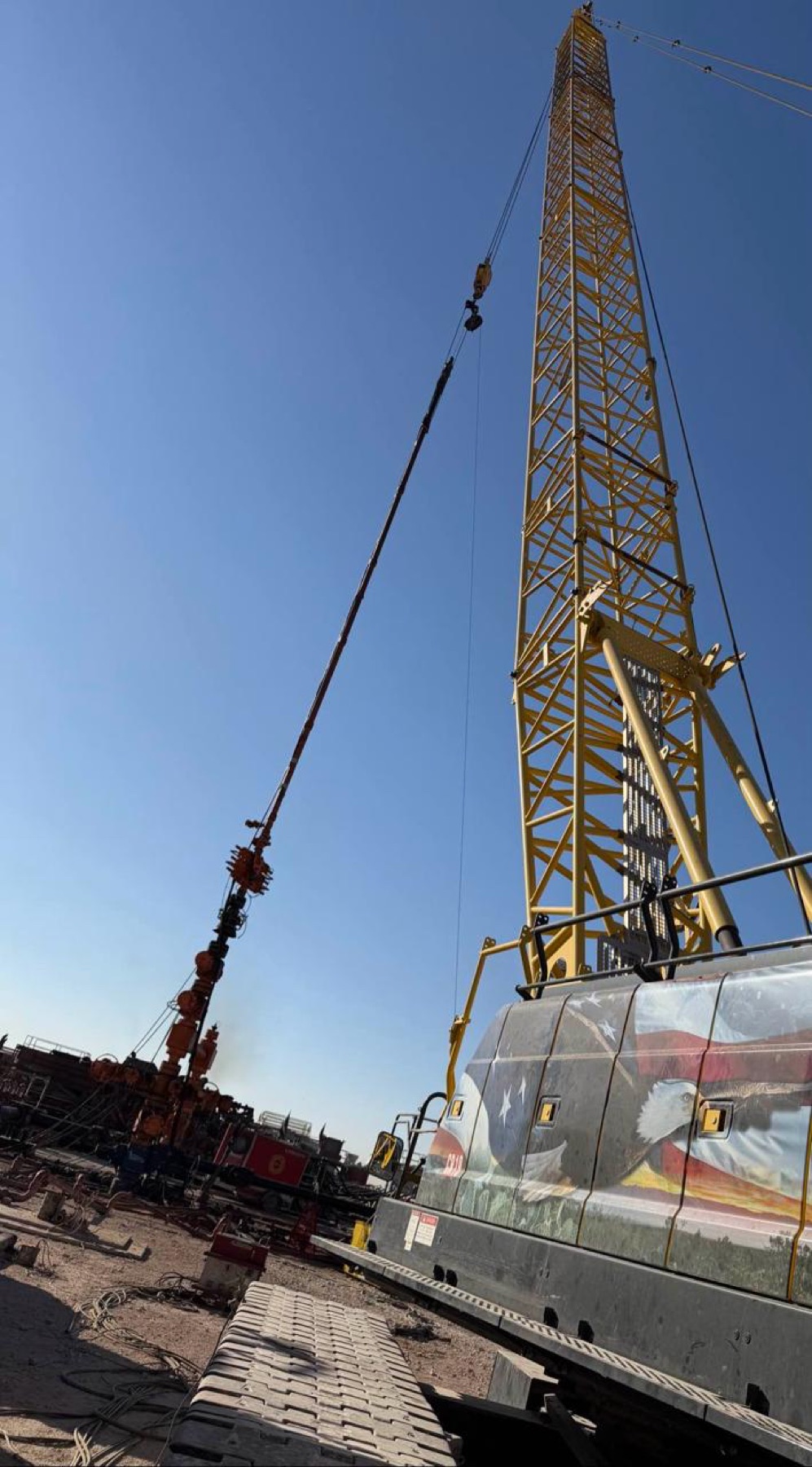 Frac site crane with American flag wrap